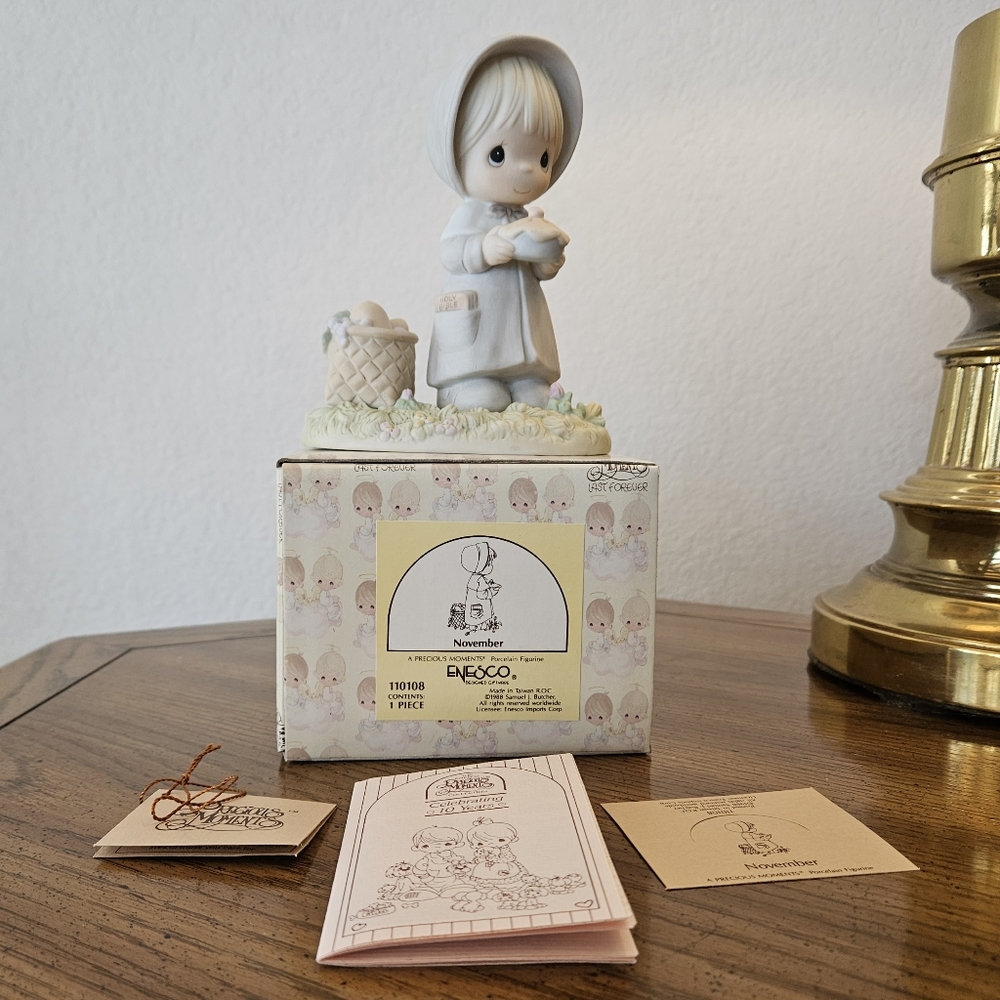 The Precious Moments "November" figurine from 1988.